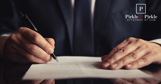 person signing a document